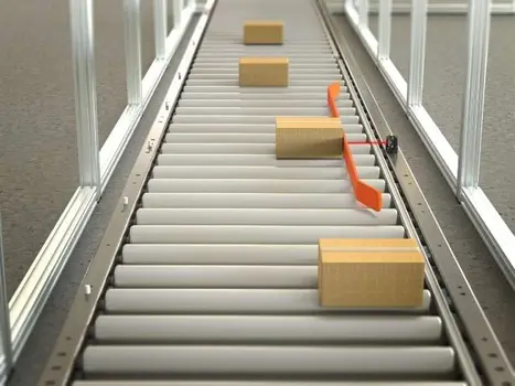 The Q20-2 sensor being used in a push-arm alignment conveyor application to align packages The Q20-2 sensor being used in a push-arm alignment conveyor application to align packages